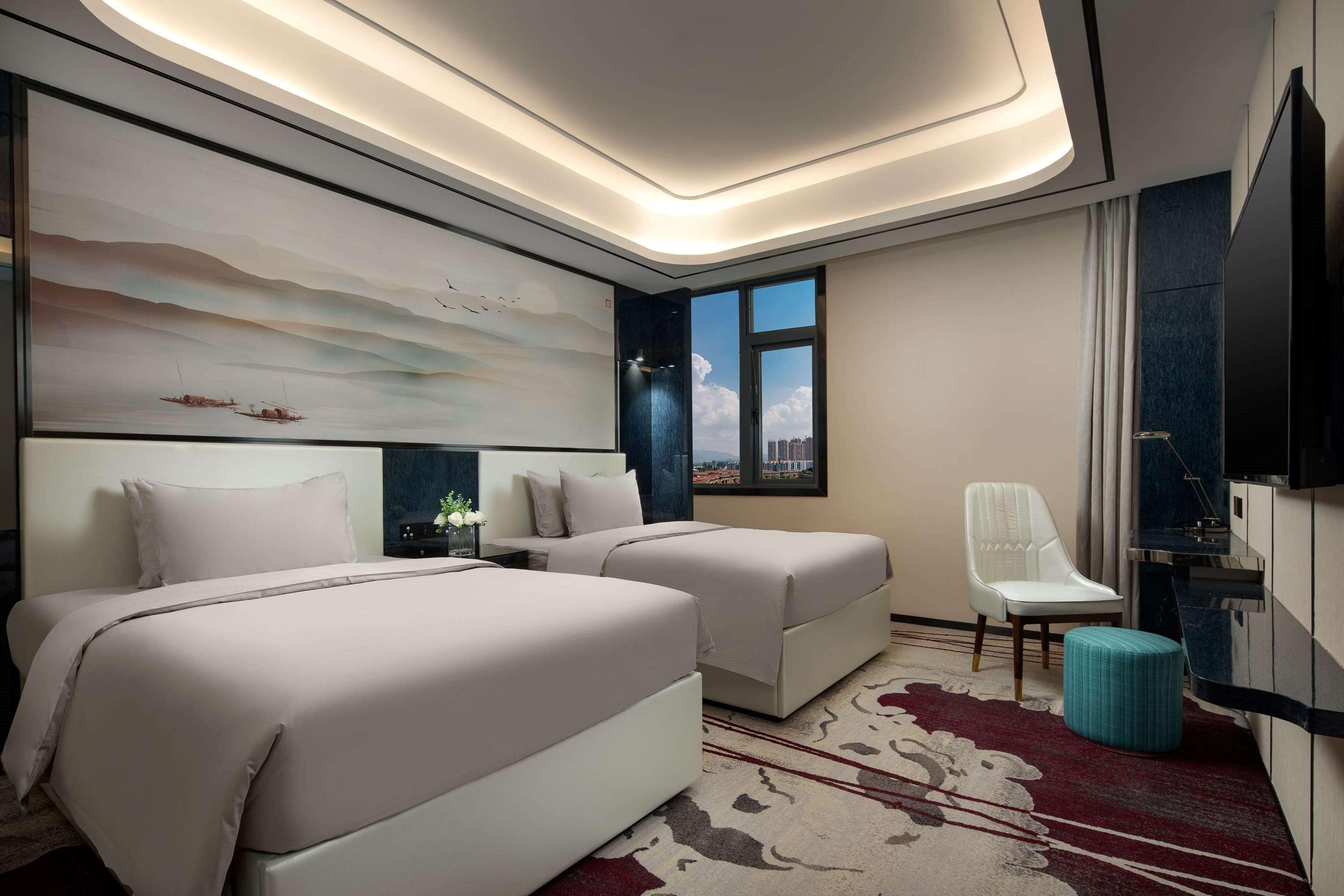 Ramada by Wyndham Mengzi Suites Bagian luar foto